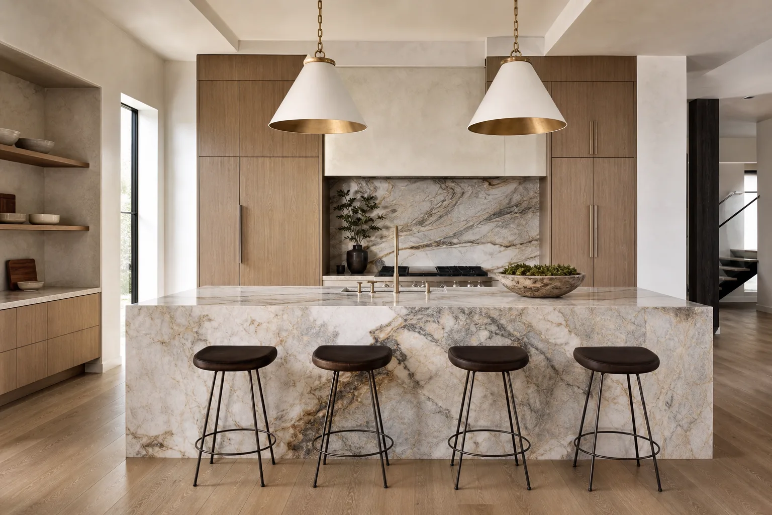 Stone kitchen island with a waterfall edge and book-matched backsplash in a modern oak kitchen